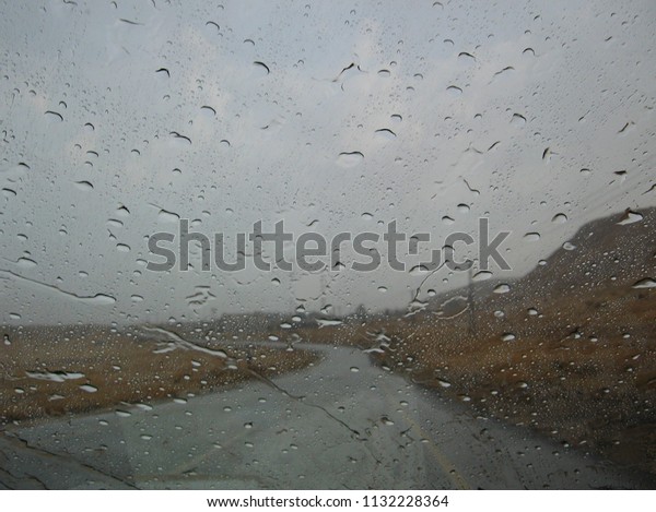 Rain drops on\
the car window seen from\
inside