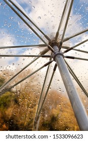 Rain Drops On A See Through Umbrella Looking Out On To Golden Autumn/fall Trees