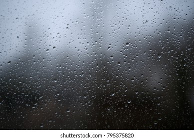 rain drops on window - Shutterstock ID 795375820