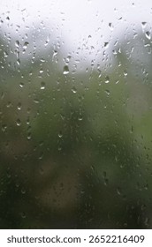Rain drops on window, blurred background