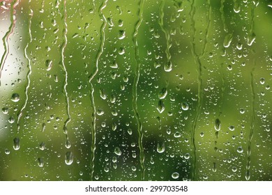 Rain Drops On Window With Green Tree In Background , Spring Rainy Day 