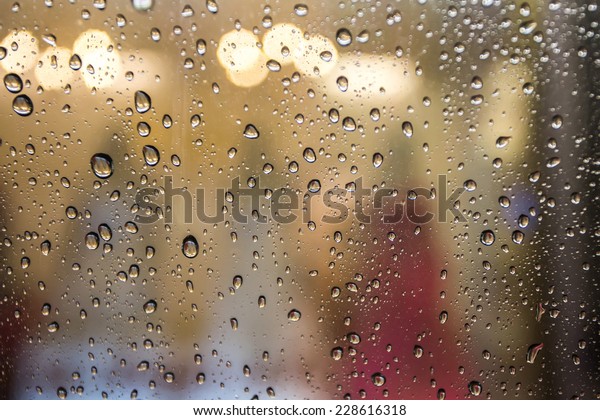 rain drops on the\
window at night time