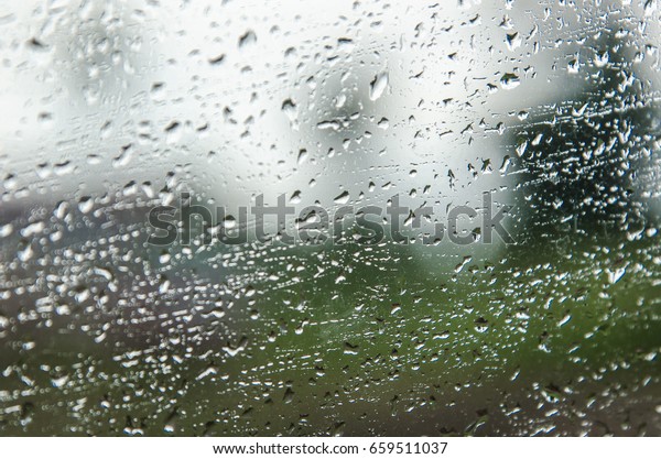 Rain\
drops on window, night storm raining car driving\
