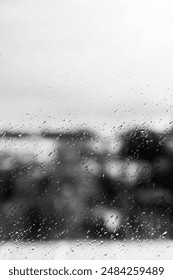 Rain drops on a window pane in nlack and white