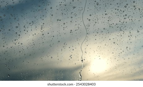 rain drops runnin down the window glass at rainy day