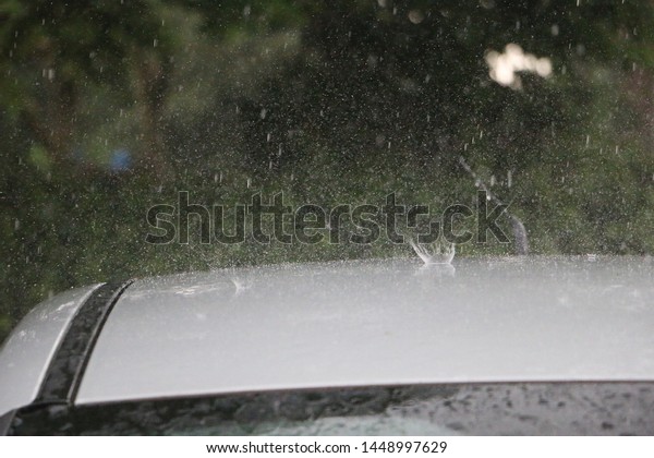 rain is falling on the\
roof from a car