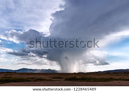 Rain falling from a thunderstorm cumulonimbus cloud