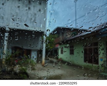 Rain Falls On The Glass. Rainy Day. House Background