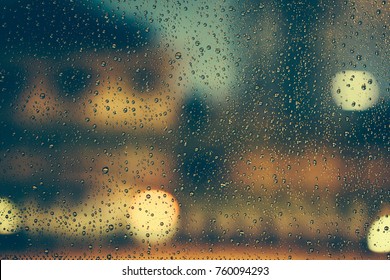 Rain fell on the car Windows, and through the Windows was a hazy night view of the city
 - Powered by Shutterstock