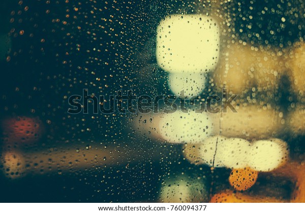 Rain fell on the car Windows, and\
through the Windows was a hazy night view of the\
city\
