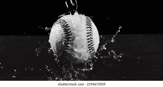 Rain Game Concept With Baseball In Water Splash For Sport Closeup.