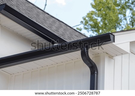rain gutter of roof with downpipe metal corner wall rooftop