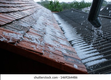 Rain with hail falls on the roof.