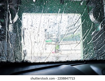 Rain, Rain Hits The Front Windshield Of The Car