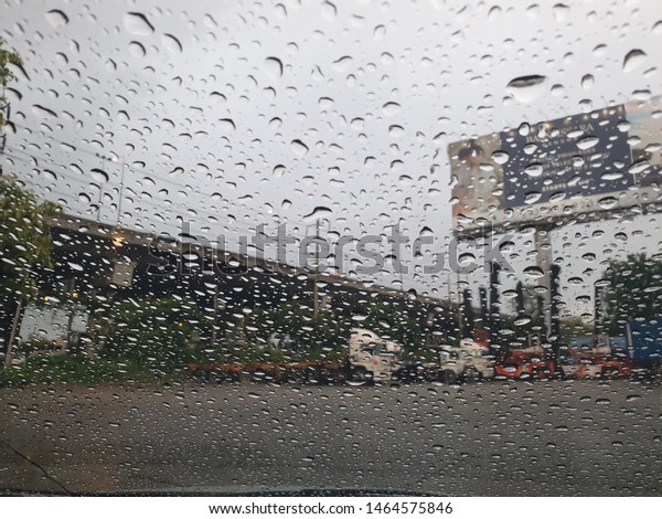 
Rain, looking through the glass, seeing cars
and concrete bridges