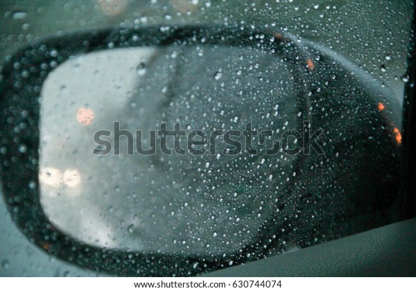 Rain makes the vision of looking at the car mirror
is not good.