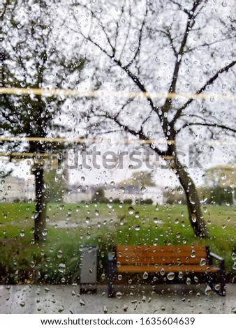 Similar – Rainy day I View through a wet window pane onto a busy street