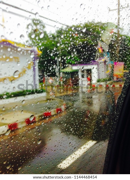 Rain on the mirror\
(Falling in my car)