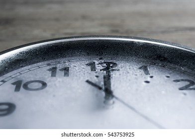 Rain on wall clock