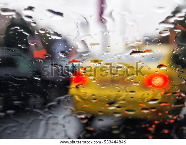 Rain on\
windshield of car seen from inside\
car