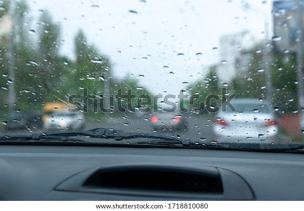 \
rain outside the car\
window, city life