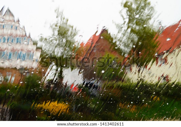 rain outside and snow the window. wet background.\
wet glass. out of focus