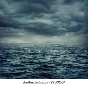 Rain over the stormy sea, abstract dark background.