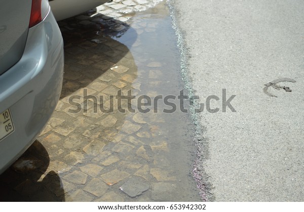 Rain puddle on the\
road outdoor background