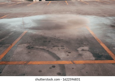 Rain puddle in a parking lot