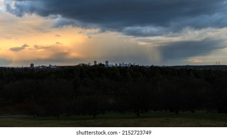 A Rain Shower Passing Over The Boston Cityscape 