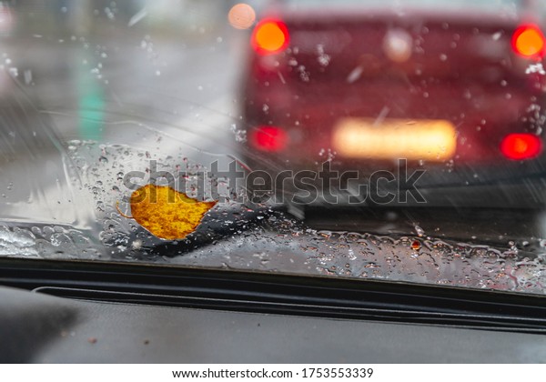 Rain, snow autumn on the road. Road accidents.
Drops on the windshield of the
car.