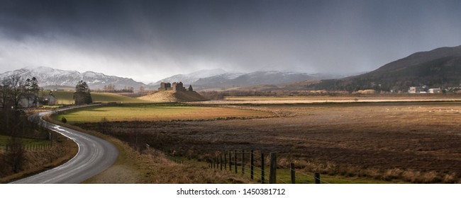 A Rain Storm In Strathspey In The Cairngorm Mountains Of The Scottish Highlands, Ruthven Barracks Stand On A Hill In The Middle Of The Valley Wetlands.