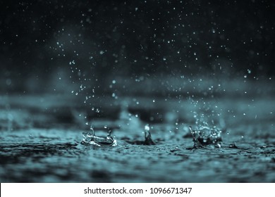 Rain water drop falling to the floor in heavy rain day

