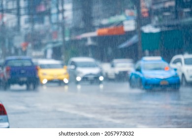 Rain Water Drop Falling To The Floor In Heavy Rain Day. Rain In The City. Road, Pavement, Car In Rain, Close Up. Water Splashes.