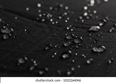 Rain Water droplets on  black waterproof fabric
