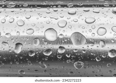 Rain water drops on a stainless steel surface. Water art background - Shutterstock ID 2342272223