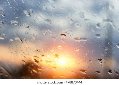 Rain Water Drops With Sun  On Glass  Background