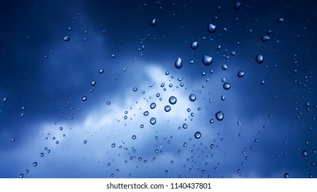 Rain water on the glass rain clouds for the background - Shutterstock ID 1140437801