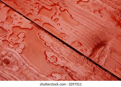 Rain Water On Rustic Red Table