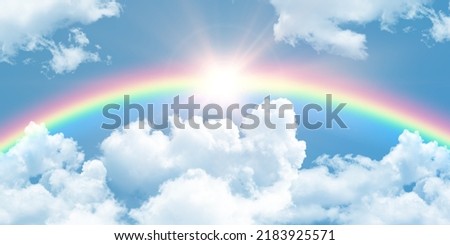 rainbow after rain and sun rays shining in blue sky. nature background. 3d stretch ceiling decoration pattern