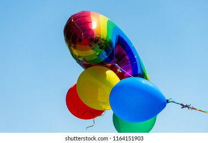 Rainbow Balloon Against Blue Sky During Gay Pride Parade