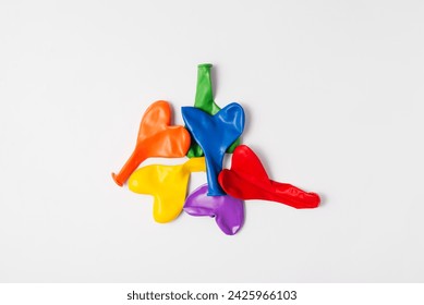 Rainbow balloon hearts for decoration in LGBT colors. Set of isolated heart shaped deflated balloons for greeting card for Pride month celebration on white background. Copy space - Powered by Shutterstock