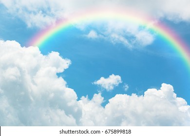 Rainbow In Blue Sky With Cloud.