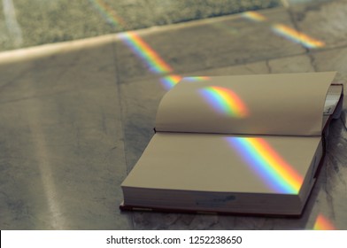 Rainbow Book. Stack Of Books In The Library And Blur Bookshelf Background