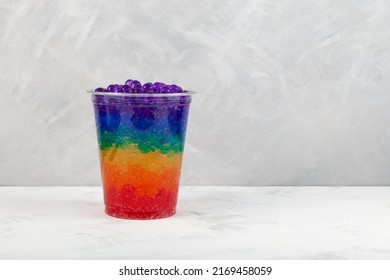 Rainbow Bubble Tea In Disposable Plastic Cup. Takeaway Food And Drink. Refreshing Summer Cocktail. Multicolored Boba Drink.