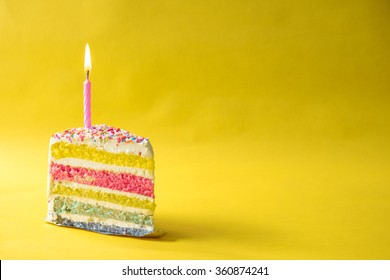Rainbow butter cake over yellow background