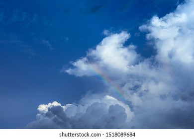 Rainbow and Cloud in blue sky background