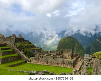 A Rainbow In Clouded Machu Picchu