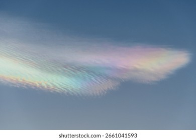 Rainbow clouds during sunset, also known as iridescent clouds, are a colorful optical phenomenon that occurs when sunlight interacts with water droplets or ice crystals in a cloud