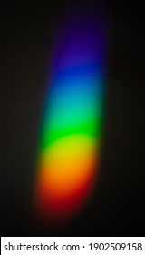 Rainbow Color Spectrum Effect On Wall, Light Scatter After Hitting The Glass Object On To A Dark Wall.